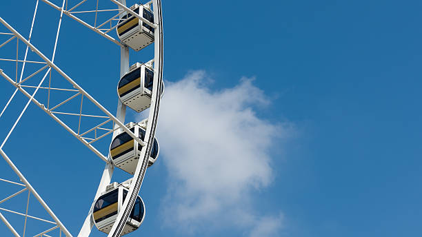 istock White Ferris wheel cloud and blue sky 164718709