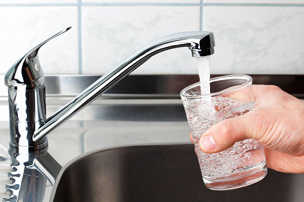 istock Glass filled with drinking water from kitchen faucet. 164719152