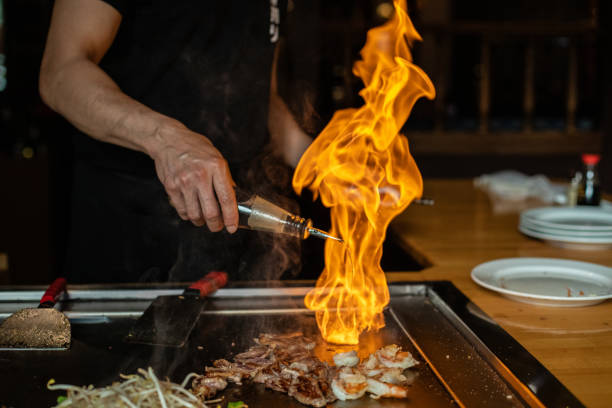 istock Chef cooking in Japanese teppanyaki restaurant 1647203514