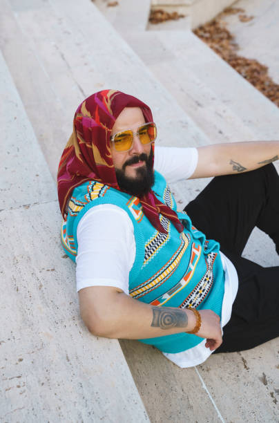 istock Bearded stylish man wearing a headscarf and posing for camera 1647247206