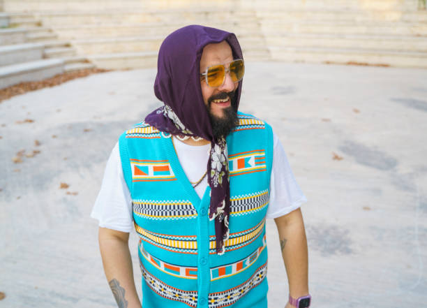 istock Bearded stylish man wearing a headscarf and posing for camera 1647247207