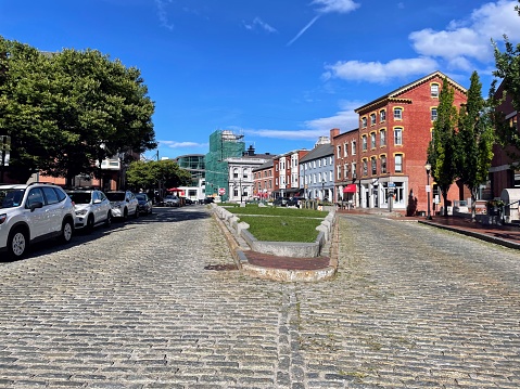 Portland, ME, 9.1.22 - Looking down the historical cobblestone road called Fore Street.