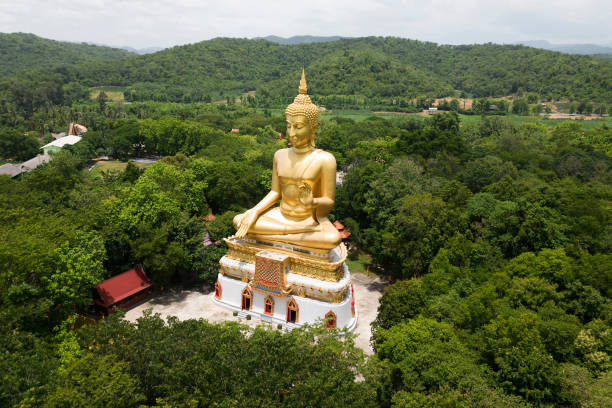 istock Luang Pho To, Wat Pha Thang, is a Buddha image enshrined outdoors in the Prathanphon posture. It is installed prominently and can be observed from a distance. 1647282553