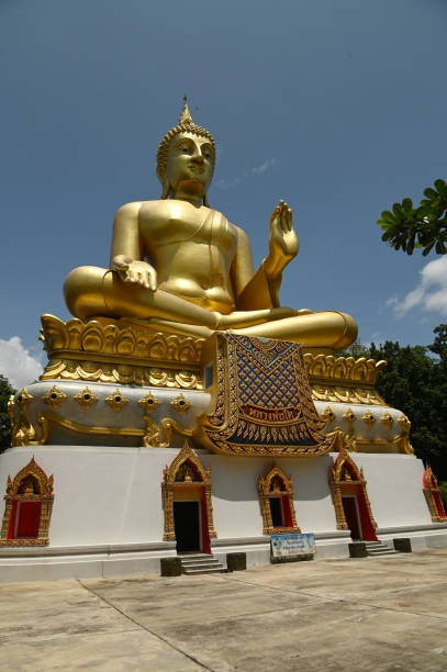 istock Luang Pho To, Wat Pha Thang, is a Buddha image enshrined outdoors in the Prathanphon posture. It is installed prominently and can be observed from a distance. 1647282555