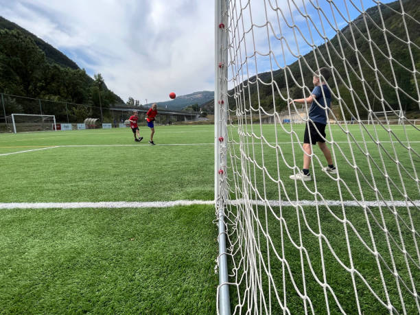 istock friends playing football 1647300110