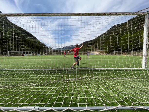 istock friends playing football 1647303353