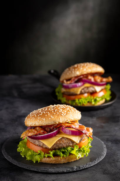 istock Delicious hamburger with meat, cheese, bacon and salad. 1647347667