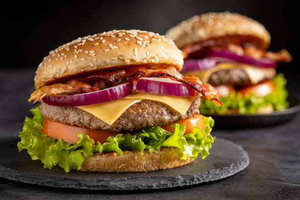 istock Delicious hamburger with meat, cheese, bacon and salad. 1647347676
