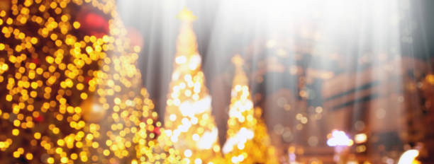 Decorated large outdoor Christmas tree with colorful lights and ornaments