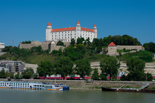 Bratislava, Slovakia. August 15, 2023. Bratislava Castle, rectangular building with four corner towers  on an rocky hill of the Little Carpathians above the Danube