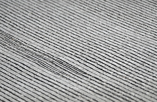 Closeup of grooved pavement.