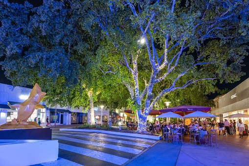 Miami Beach, Florida - May 1, 2023 - Outdoor restaurants on Lincoln Road Mall at night.
