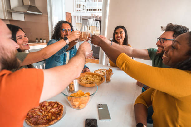istock Friends Toasting With Champagne At Home 1647414873