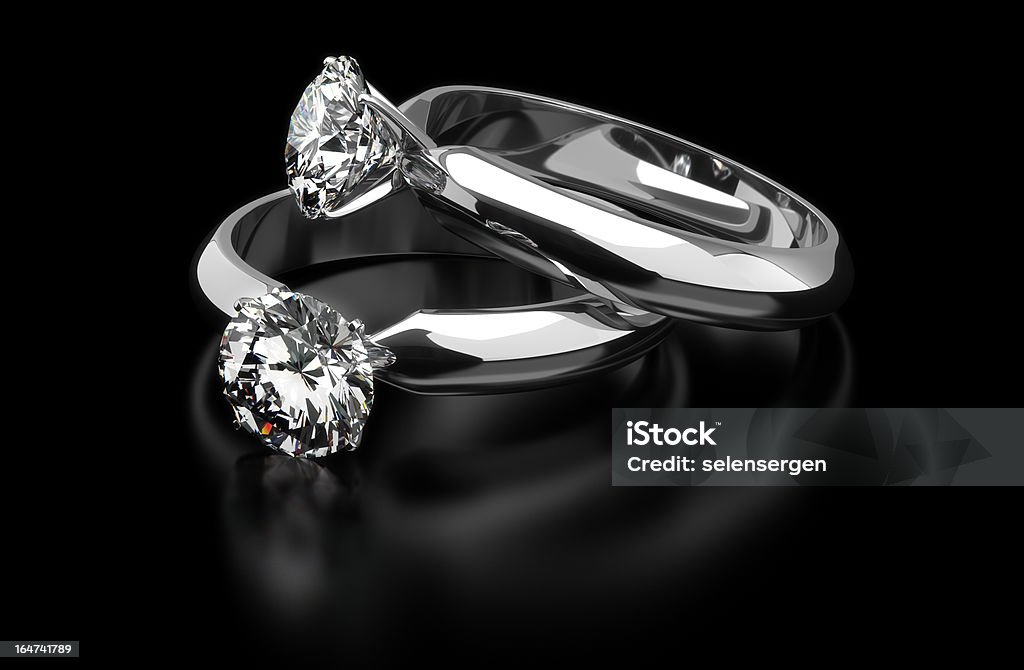 Diamond Rings Two diamond ring on black background Black Color Stock Photo