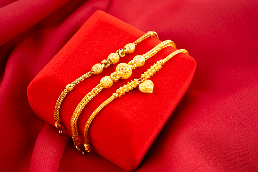 Gold Bracelets on white background