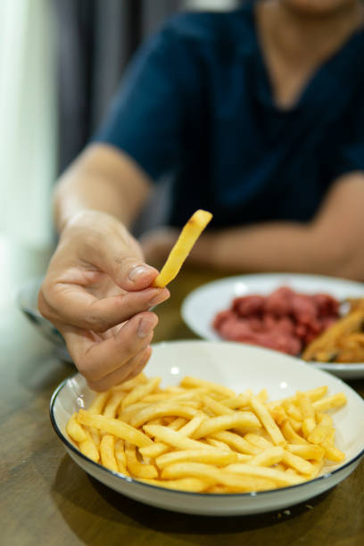 istock Close up hand holding food 1647438725