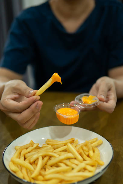 istock Close up hand holding food 1647438752