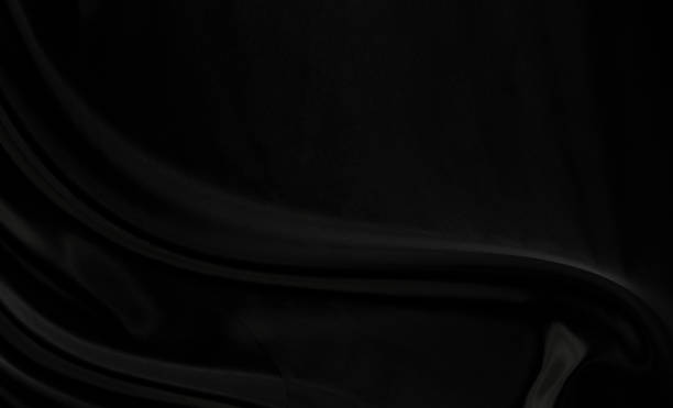 istock Black gray satin dark fabric texture luxurious shiny that is abstract silk cloth background with patterns soft waves blur beautiful. 1647441859