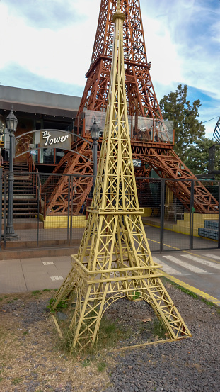 Ituzaingo, Argentina - Jul 29, 2023: Replica of the Eiffel tower, artwork by Ruben Diaz, at the entrance of a beer house in Ituzaingo, Buenos Aires Province, Argentina.