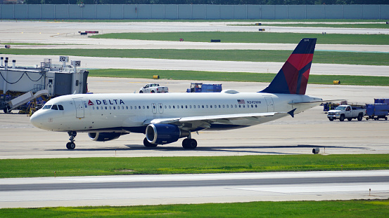 Chicago, IL, USA - August 2 2023:  Delta Airlines plane taxies on the runway after landing at Chicago Midway International Airport.