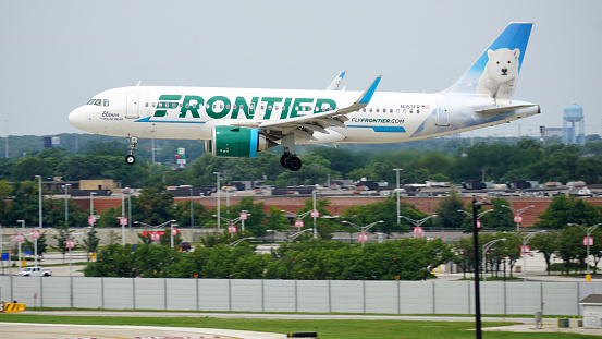 Chicago, IL, USA - August 2 2023: Frontier Airlines Airbus A320neo with Blanco the Polar Bear livery lands at Chicago Midway International Airport.