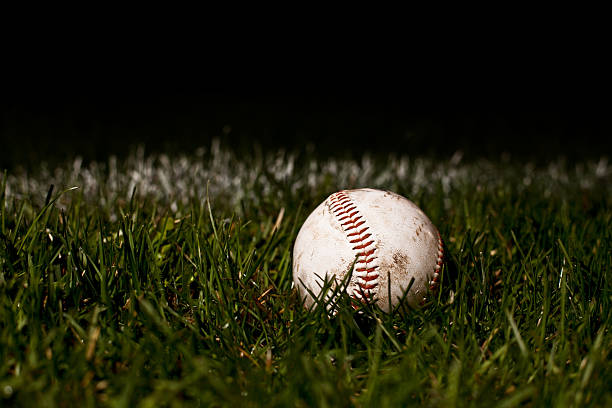 istock A used baseball laid on fresh green grass. 164751326