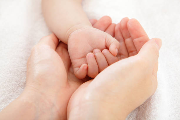 little baby hand with mother hand, close up, concept for love