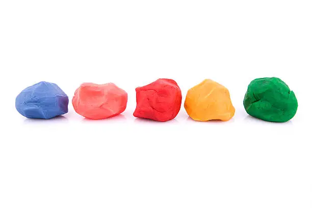 Photo of colorful plasticine:Child's Play Clay isolated on white background