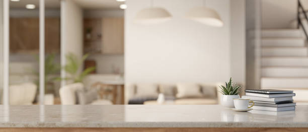 istock Empty space on a tabletop with a blurred modern Scandinavian living room in the background. 1647551001