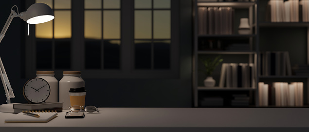 An empty mockup space for displaying your product on a black table in a modern dark office or home workspace at night. close-up image. 3d render, 3d illustration