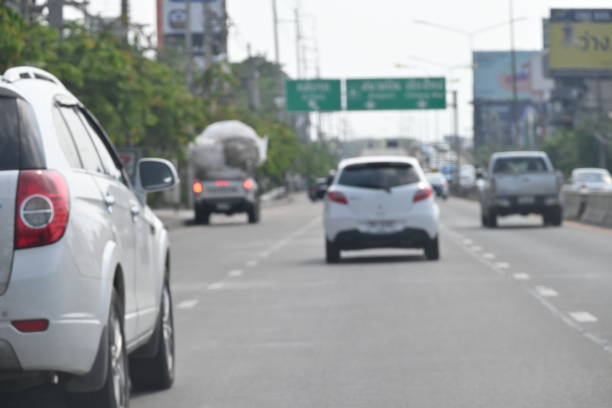 highway traffic with safety barrier on road asphalt, blurred image