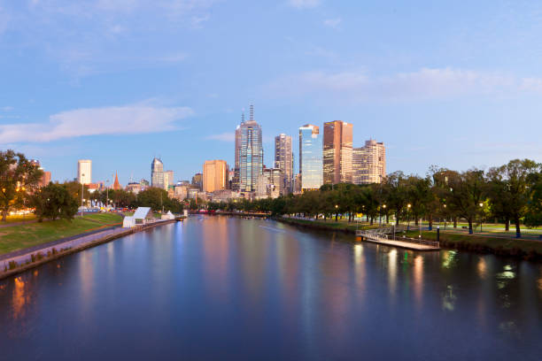 Looking over the Yarra River on dawn into the city of Melbourne the the buildings reflecting the morning light.