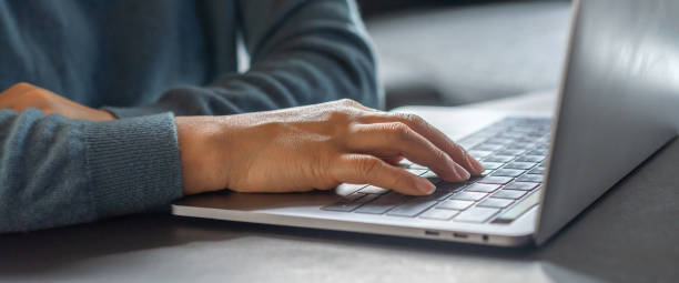 istock Woman working with modern laptop computer on desktop screen for advertising, mockup, technology, advertising, search information, creative design, learning, webinar, study, watching on table 1647616054