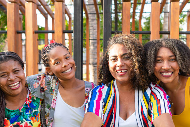 istock Multicultural best friends having fun taking group selfie portrait outside 1647635381