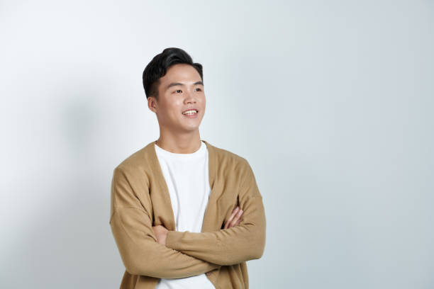istock Image of young Asian man posing on white backround 1647640693