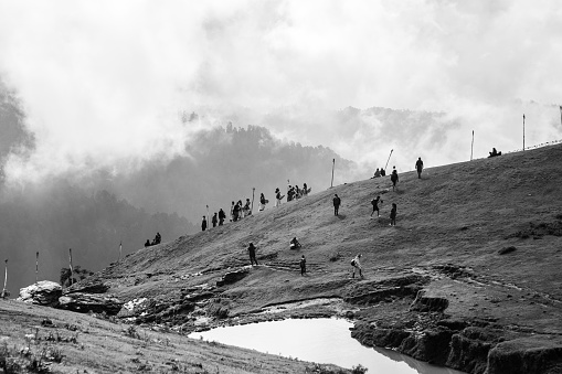 Bonbo Shamans climbing to the top of Shailung hills to perform their yearly ritual