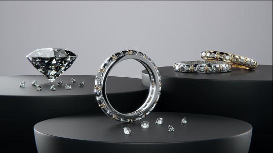 Gold and platinum diamond rings with diamonds of various sizes. on the black product display Designed with 3D rendering.