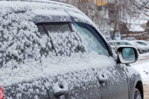 istock snow covered car at daylight 1647717947
