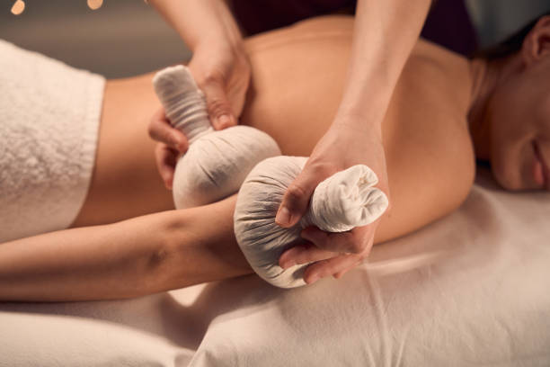 istock Wellness center patient receiving hot compress arm massage 1647731321