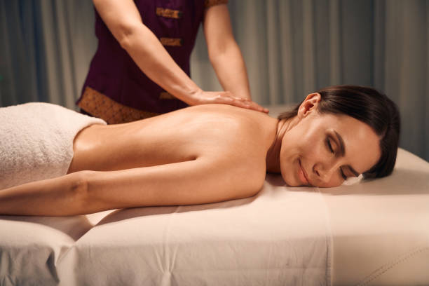 istock Female client getting upper back massage in wellness center 1647731353