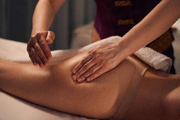 istock Spa therapist giving buttock massage to patient 1647731365