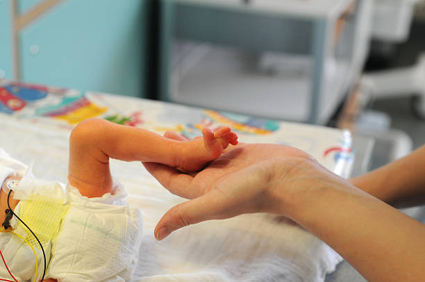 istock Newborn baby in incubator 164773373