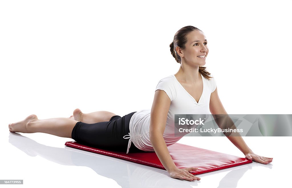 Mujer haciendo ejercicios de estiramiento - Foto de stock de Actividades y técnicas de relajación libre de derechos