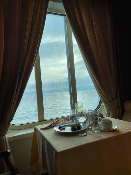 istock Dining table in front of sea view window 1647753199