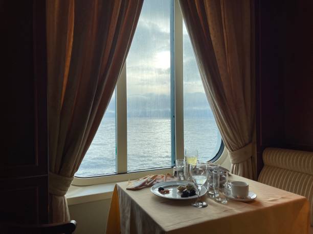 istock Dining table in front of sea view window 1647753210