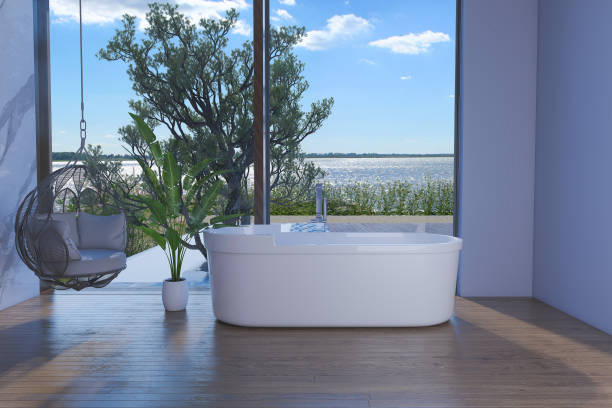 istock Bathroom with bathtub in front of sea view. 1647764284