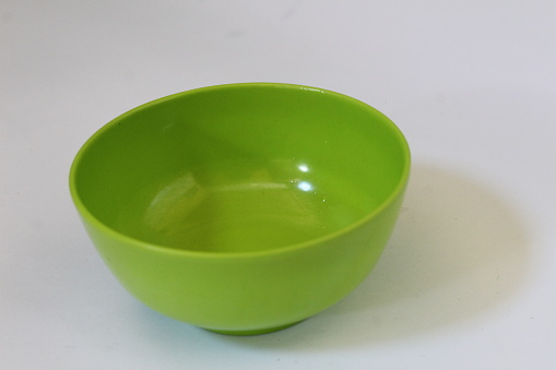Green bowl isolated in white