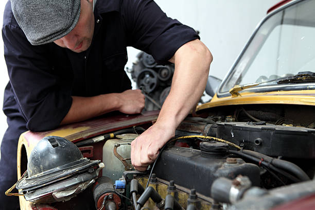 istock Mechanic repairing car 164778340