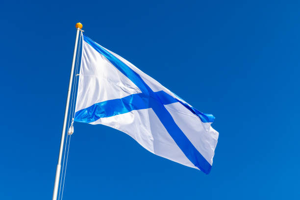 istock Ensign of the Russian Navy is under blue sky 1647790014