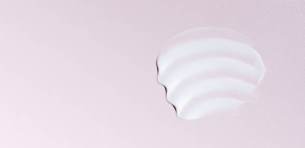 istock cosmetic smear cream texture on pink background 1647790026